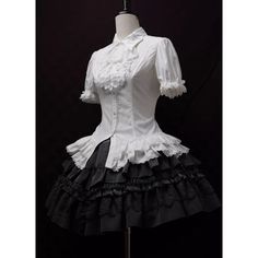 An item that will make you look like a mysterious and elegant young lady. It is richly decorated with lace embroidery and frills, and when paired with a bold chest ornament, it further enhances the gorgeous atmosphere. Like an aristocratic lady from medieval Europe. 
 
 

 

 
 
 
 Item 
 
 Blouse (black) + Jabot (black) 
 Blouse (purple) + jabot (purple) 
 Blouse (white) + Jabot (white) 
 Blouse (white) + Jabot (black) 
 Brooch (black x blue) 
 Brooch ( Black x Red) 
 Brooch ( Black x Purple) Elegant White Blouse With Lace Patchwork, White Lace Patchwork Blouse For Party, White Doll Collar Blouse For Party, White Doll Collar Blouse, White Fitted Blouse With Ruffled Collar, White Ruffled Collar Blouse For Wedding, White Blouse With Ruffled Collar For Wedding, White Cotton Formal Blouse, White Short Sleeve Blouse For Party