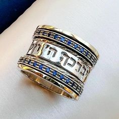 May the Lord Bless & Keep You Ring ✨ Handcrafted in Silver 925 & 14k Gold with Blue Sapphire Stones | A Divine Symbol of Faith & Protection! ✨ Divine Protection in Every Detail This stunning ring is meticulously handcrafted from high-quality Sterling Silver 925 and 14k Gold, creating a timeless piece that radiates elegance and grace. Adorned with exquisite Blue Sapphire Stones, this ring not only captures attention with its beauty but also holds a deep spiritual meaning that makes it truly speci Blue Sterling Silver Jewelry Stamped 14k, Sacred Jewelry, Divine Protection, Royal Beauty, Sapphire Stones, Let It Shine, Sacred Symbols, Spiritual Meaning, Sapphire Stone