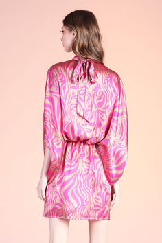 Add a little spice to your formal wear with our Frida Luxe Satin Mock Neck Caftan Mini Dress. This print is beautiful and gives the perfect touch of color to the closet. The dress pulls over the body and secures with a tie behind the neck. The waist is elastic to keep the body in place from day to night. Pair with minimal accessories and neutral shoes. SKU #: D-7931 Printed Beachwear Party Dress, Silk Tie Waist Dresses For Daywear, Spring Party Mini Dress With Tie Neck, Chic Fitted Summer Kaftan, Elegant Multicolor Dresses With Kimono Sleeves, Pink Tunic Party Dress, Pink Tunic Dress For Party, Chic Party Tunic Kaftan, Fitted Dresses With Kimono Sleeves For Daywear