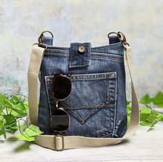 a denim bag with sunglasses in the pocket