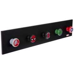 a black wall mounted switch plate with four knobs and spiderman symbols on it