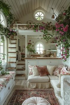 a living room filled with lots of furniture and flowers on the wall next to stairs