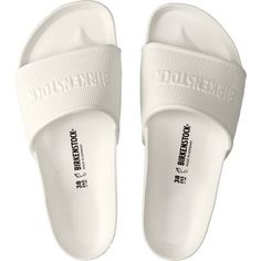 We love slipping on our Barbados Sandal after hopping into the pool. This sandal delivers all of the comfortable qualities of a Birkenstock original cork sandal, except this one is made with waterproof and mega lightweight materials, making it a great travel and beach companion. Comfortable White Slides With Cork-bed Midsoles, Summer Slides With Branded Insole In Synthetic Material, White Slides With Cork-bed Midsoles For Beach, Casual White Slides With Cork-bed Midsoles, Summer Outdoor Slides With Cork-bed Midsoles, White Slip-resistant Sandals For The Beach, White Summer Slides With Textured Footbed, White Textured Footbed Summer Slides, White Textured Slides For Summer