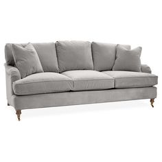 a gray couch with pillows on it