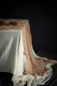 an empty table with a white cloth on it