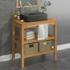 a bathroom with a sink, mirror and towel rack