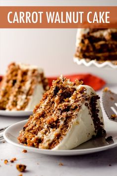 a slice of carrot cake on a plate with a fork next to it and another piece in the background