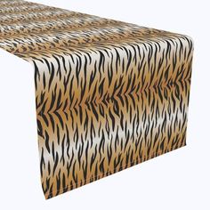 an animal print table runner on a white background