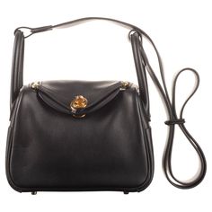 Brand: Hermès Style: Lindy Size: 20cm Color: Black Material: Swift Leather Hardware Gold (GHW) Dimensions: 7.5" W x 5" H x 3.75" D Handle Drop: 4" x 22" Hermes Collection, Mini Lindy, Leather Hardware, Handle Bag, Fashion Handbags, Gold Hardware, Top Handle, Top Handle Bag, Purses And Bags