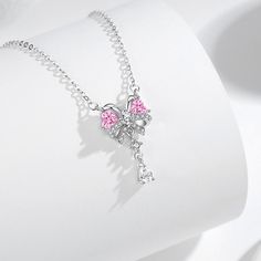 Crafted with 925 silver, this stunning necklace features a delicate pink butterfly heart and sparkling CZ diamonds. Made with superior materials, this necklace will add elegance and charm to any outfit. Perfect for any occasion, this necklace is a must-have for any jewelry collection. Tarnish proof Water proof Sleep / Nap proof Safe for sensitive skin Wear it while working out &showering Designed to wear 24/7 If there is no stock, the product will take 60 days to produce Please leave your usual Personalized Tie Clip, Sun And Moon Rings, Butterfly Heart, Flat Back Earrings, Moss Agate Ring, Feather Necklaces, Gold Bracelet Chain, Rose Gold Jewelry, Blue Zircon