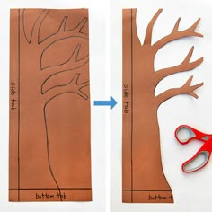 paper cut out to look like a tree with scissors next to it and another piece of cardboard cut into the shape of a tree