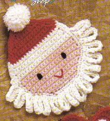 a knitted santa clause ornament with a red hat and white pom - pom