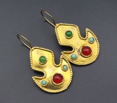 I am offering Afghan Turkmen alpaka gold wash earrings. Its %100 hand crafted workmanship with beautiful glass beads earrings. Please do not hesitate to contact if you have any questions. Length : 1.8" ( 4.5 cm ) Width : 0.9" ( 2.4cm ) Weight : 9.0 Grams, Shipping & Estimated Delivery Time With Turkish Registered Post, Destination Country Standard Shipping (business days) United States 15-20 Europe 7-15 Asia 15-25 Australia 15-20 Artisan Gold Beaded Earrings, Unique Festive Beaded Earrings, Unique Beaded Earrings For Festive Occasions, Unique Festive Earrings With Ear Wire, Unique Gold Brass Beaded Earrings, Unique Gold Beaded Earrings For Gift, Handmade Gold Plug Earrings, Festive Brass Beaded Earrings, Gold Beaded Round Earrings As Gift