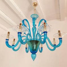 a blue chandelier hanging from the ceiling