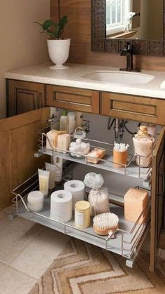 a bathroom sink with lots of soap and lotion on the shelf next to it