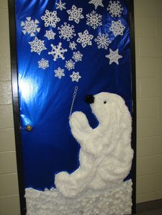 a door decorated with snowflakes and a polar bear