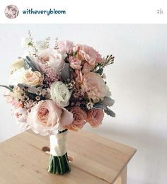 a bouquet of flowers on top of a table