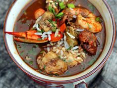 a bowl filled with seafood and rice soup