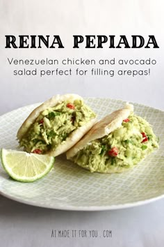 a plate with two tacos and a lime wedge on it that reads reina pepada venezuelan chicken and avocado salad perfect for filling areas