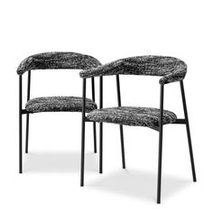 two black and white chairs sitting next to each other