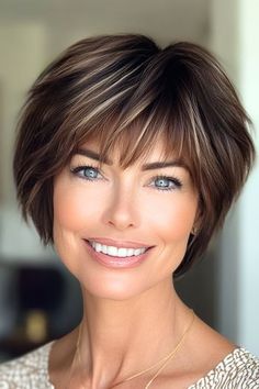 Save this pin for the best short layered haircuts with bangs. This chic pixie cut offers a perfect blend of edgy and refined. The layers are cut to create a piecey, textured look. Wispy bangs softly graze the brows. Short Haircut With Wispy Bangs, Luxury Hairstyles, Textured Haircuts, Easy Haircuts, Short Textured Haircuts, Elegant Short Hair, Shaggy Pixie, Layered Haircuts For Women