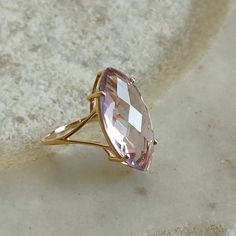 ITEM DESCRIPTION: >>The Ring is made from Solid 14K Yellow Gold. Gemstone used is absolutely natural and ethically sourced. >>Natural Pink Amethyst in marquise shape and briolette cut is studded on it with utmost precision. Gem: Pink Amethyst Gem size: 20x10 mm and Marquise Gem weight: 5.50 carat Gold purity: 14K (58.33% approx.) Gold weight: 1.30 grams Gross weight : 2.40 grams The Gold purity is guaranteed and it comes with authentic 14K gold hallmark. Since these Rings are handmade, they are 14k Gold Diamond Cut Amethyst Ring, 14k Gold Amethyst Ring With Diamond Cut, Fine Jewelry, 14k Gold Amethyst Ring With Diamond Cut, Gift Marquise Amethyst Ring In Yellow Gold, 14k Gold Lavender Amethyst Ring, Gift Yellow Gold Marquise Amethyst Ring, Yellow Gold Marquise Amethyst Ring As Gift, Fine Jewelry 14k Gold Marquise Amethyst Ring, Marquise Amethyst Ring In 14k Gold