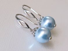 Wedding Light Blue Blush Blue Pearl Drop Silver Dangle Bridal Earrings. EARRINGS are about 1.18 inch (3cm) long from top of earring wire to bottom. BRIDAL EARRINGS SECTION: https://www.etsy.com/shop/LanaChayka?ref=seller-platform-mcnav§ion_id=11638940 BRIDAL JEWELRY SETS SECTION: https://www.etsy.com/shop/LanaChayka?ref=seller-platform-mcnav§ion_id=25839214 BRIDAL NECKLACES SECTION: https://www.etsy.com/shop/LanaChayka?ref=seller-platform-mcnav§ion_id=11638944 Elegant and classy, these earrings Elegant Blue Pearl Earrings, Light Blue Jewelry For Wedding, Blue Drop Earrings For Bridal Formal Occasion, Elegant Blue Teardrop Bridal Earrings, Blue Round Bridal Earrings For Formal Occasions, Blue Drop Earrings For Formal Bridal Wear, Elegant Light Blue Teardrop Jewelry, Blue Bridal Earrings For Formal Occasions, Elegant Blue Bridal Earrings For Bridesmaids