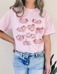 Strawberry Cottagecore Vibe Cute Fruit Shirt🍓 SIZING & MATERIALS: Printed on Unisex Comfort Colors c1717 garment-dyed t-shirt for a relaxed fit; the fabric brings extra coziness to your wardrobe while the relaxed fit makes it an excellent daily choice.  .: 100% ring-spun cotton .: Medium fabric (6.1 oz/yd² (206.8 g/m *Sizing down one size will give you a more fitted look* *Sticking with your normal size gives a nice relaxed look* *Sizing up 1-2 sizes gives an oversized look* Please compare meas Trendy Tri-blend Tops For Summer, Spring Short Sleeve Tops With Screen Print, Tri-blend Crew Neck Top For Summer, Printed Graphic Tee With Relaxed Fit, Pink Short Sleeve Top With Screen Print, Casual Pink Tops With Screen Print, Cotton Relaxed Fit Tops With Screen Print, Relaxed Fit Cotton Top With Screen Print, Summer Tri-blend Shirt With Graphic Print