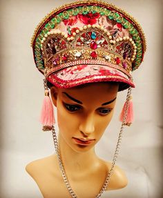 This is a stunning one off hand crafted captain hat. It has a pink rose detail. A feast fir the eyes! It is enriched with gems, beads ,jewels ,trim and feather. It has chains and tassels detail. This is stunning hat . It is a size 59 Cm which fits most heads . Any trace of glue or creases are not defects but characteristics of a hand crafted hat and markings are deliberate to create a rustic antique look. Thank you for looking Traditional Adjustable Costume Hats And Headpieces For Party, Traditional Adjustable Party Costume Hats And Headpieces, Handmade Costume Hat With Round Crown For Party, Carnival Festival Headpiece With Structured Crown, Bohemian Costume Hat With Structured Crown For Festivals, Unique Festival Headpiece With Tall Crown, Unique Tall Crown Headpiece For Festival, Traditional Carnival Costume Hats And Headpieces For Party, Adjustable Costume Hats And Headpieces For Festivals