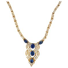 Classically designed 18 karat yellow gold necklace. The centerpiece of this necklace is set with 5 oval blue sapphires. The sapphires are accented with round diamonds set in marquise and diamond shaped links which continue to form the chain of the entire 18" necklace. Diamond weight 4.24 carats Blue Sapphire weight 5.54 carats Stamped Italy 18k Luxury Sapphire Gold-plated Jewelry, Retro Engagement Rings, Sapphire Diamond Necklace, Gold Drop Necklace, Round Diamond Setting, Yellow Gold Necklace, White Gold Chains, Blue Sapphire Diamond, Classic Necklace