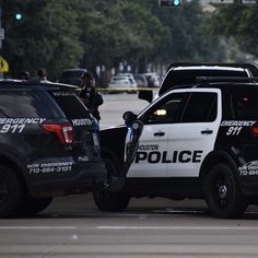 two police cars that are parked next to each other on the side of the road