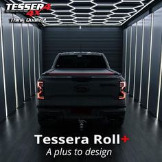 the back end of a black truck in a storage room with text that reads, tessena roll + a plus to design