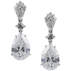 An absolutely gorgeous statement piece, these earrings are perfect for black tie wedding or elegant gala. This incredible pair of diamond drop earrings feature a matched pair of spectacular GIA certified E color, VS2 clarity pear shape diamonds, weighing 5.01 and 5.05 carats respectively. These pear shapes are suspended from two Asscher-cut and kite-shaped diamonds. The Asscher cut diamonds weigh 0.45 carat total, and the kites total 0.92 carats. The earrings are crafted in 18K white gold with d Most Expensive Jewelry, Vintage Drop Earrings, Engagement Earrings, Platinum Earrings, Asscher Cut Diamond, Asscher Cut, Expensive Jewelry, Fine Jewelry Designers, Diamond Drops