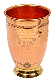 a large metal cup sitting on top of a gold plated stand with a white background