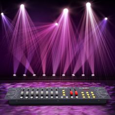 there are many lights that are on the stage and in front of it is a sound board