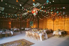 a large room with tables and chairs set up for an event