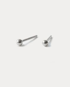 or Save $60 with Sets here The mini version of our original Ball Studs that everyone's been asking for. Designed at 3mm in diameter, they're the perfect petite size and contrast to add to your Earring Capsule. Handcrafted in recycled sterling silver Measures: 3mm in diameter Notched posts for added security Sold as a pair Free shipping on orders over $120 & 30-day returns learn more Ball Stud Earrings, Travel Box, Couple Items, Fine Jewels, Recycled Gold, Recycled Sterling Silver, Petite Size, Silver Earrings Studs, Precious Metals