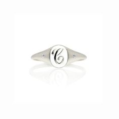 This initial and diamonds mini signet ring makes the perfect pinky ring–  personalized with an initial of your choosing is hand engraved in a classic script font by our master engraver here in Hatton Garden, and set with 2 diamonds either side to give it extra sparkle – under-stated elegance with a vintage, personalised feel – this ring would make a fabulous gift for a special occasion.Effortlessly stylish our monogram ring looks great worn as a pinky ring or on other fingers for a minimalist lo Classic Personalized Cubic Zirconia Diamond Ring, Personalized Classic Cubic Zirconia Diamond Ring, Classic Cubic Zirconia Initial Promise Ring, Personalized Silver Cubic Zirconia Diamond Ring, Silver Initial Ring With Diamond Accents For Wedding, Silver Wedding Initial Ring With Diamond Accents, Silver Initial Ring With Vvs Clarity For Anniversary, Wedding Initial Ring In White Sterling Silver, Silver Vvs Clarity Initial Ring For Anniversary