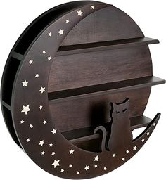 a wooden shelf with a cat sitting on it's side and the moon in the middle