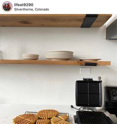 some waffles are sitting on the counter in front of a stove top oven