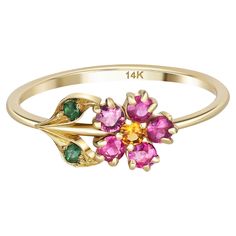 Pink sapphires flower ring in 14 karat gold. Tiny gold ring. Pink sapphire ring. Gold flower ring. Daisy flower ring. Pink gem ring. Material: 14k gold Weight: 1.40 g. depends from size. Set with sapphires, color - pinkish red, yellow. Round cut, 0.025x6 = 0. 15 ct. in total Clarity: Transparent with inclusions. Surrounding stones: chrom diopsides - round cut, green, transparent 2 x 0.025 ct = 0.05 ct. october Pink Gem Ring, Pear Sapphire Ring, Sapphire Ring Gold, Gold Flower Ring, Pink Sapphire Ring, Diamond Fashion Rings, Gem Ring, Modern Ring, Enamel Ring