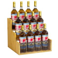 twelve bottles of wine are in a wooden holder