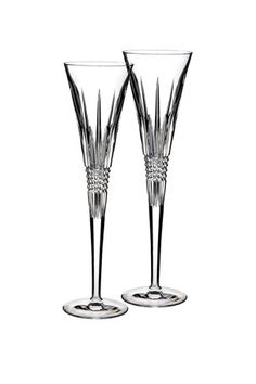 two wine glasses sitting next to each other