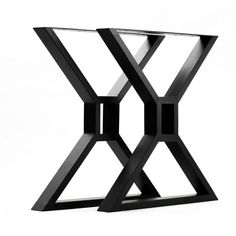 a black side table with an x design on the top and bottom, against a white background