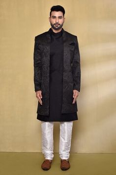 Blackish blue nawabi jacket with woven leaf patterns. Comes with sleeveless pintucked kurta and white churidar. - Aza Fashions Designer Nehru Jacket With Stand Collar For Winter, Traditional Tailored Festive Outerwear, Traditional Tailored Outerwear For Festive Season, Fitted Bandhgala With Stand Collar For Fall, Black Festive Winter Outerwear, Festive Black Winter Outerwear, Black Winter Festive Outerwear, Fall Season Fitted Long Sleeve Sherwani, Designer Tailored Outerwear For Festive Occasions