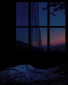 the sun is setting in the distance through an open window with a blanket on it