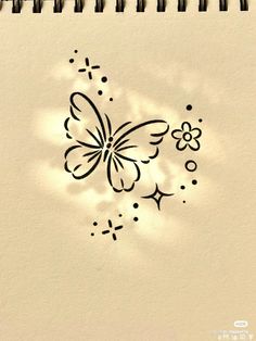 a drawing of a butterfly on a piece of paper with the shadow of a flower