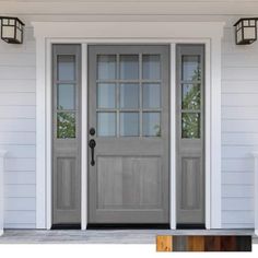 the front door is painted gray and has two sidelights on either side of it