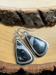 Authentic White Buffalo Stone in 925 Sterling Silver One of a kind design Teardrop design with soft black patina  Modern and sleek quality jewelry Handmade in the PNW Unique Black Teardrop Earrings, Artisan Black Drop Earrings, Black Artisan Drop Earrings, Unique Black Hypoallergenic Jewelry, Everyday Black Oxidized Earrings, Black Artisan Earrings, Unique Black Teardrop Jewelry, Patina Earrings, White Buffalo