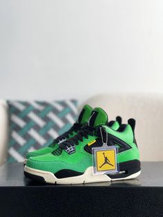 Embrace exclusivity with these Air Jordan 4 Retro "Manila"-inspired sneakers. This legendary colorway, originally a regional exclusive, is reimagined with meticulous attention to detail. The vibrant green upper, crafted from suede and textured leather, delivers a luxurious look and feel. The iconic silhouette, complete with signature mesh netting and a visible Air unit, ensures both classic style and all-day comfort. Step into sneaker history with these ultra-rare, head-turning kicks. Jordan 4 Manila, Fall Winter Jacket, Retro 4, Mesh Netting, Jordan 4 Retro, Air Jordan 4, Air Jordan 4 Retro, Loafer Sneakers, Bottega Veneta Shoulder Bag